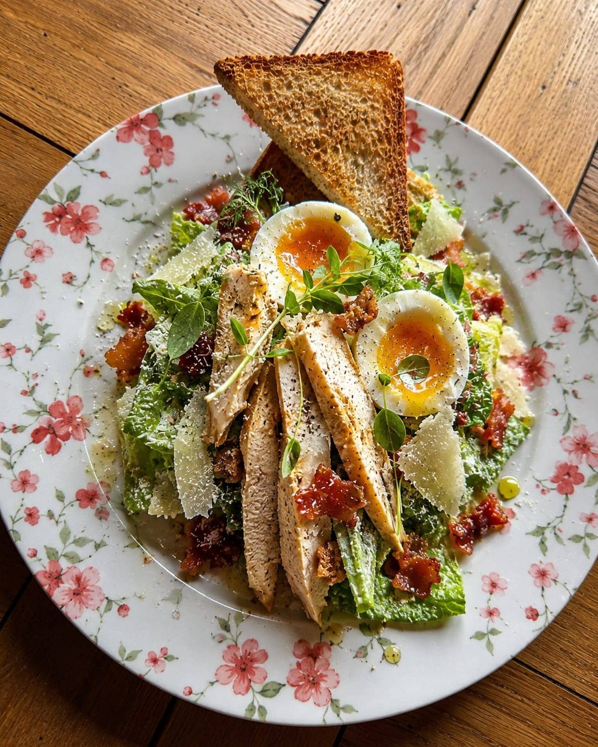 High-protein Caesar salad with chicken, soft-boiled egg and parmesan